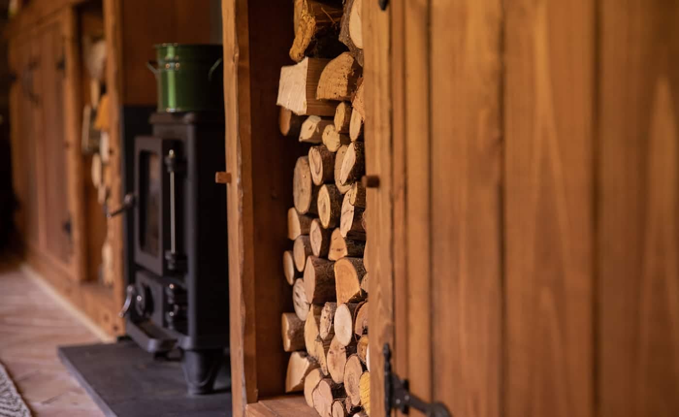 Hobbit small wood burning stove installed in a cabin designed by Blue Forest 3