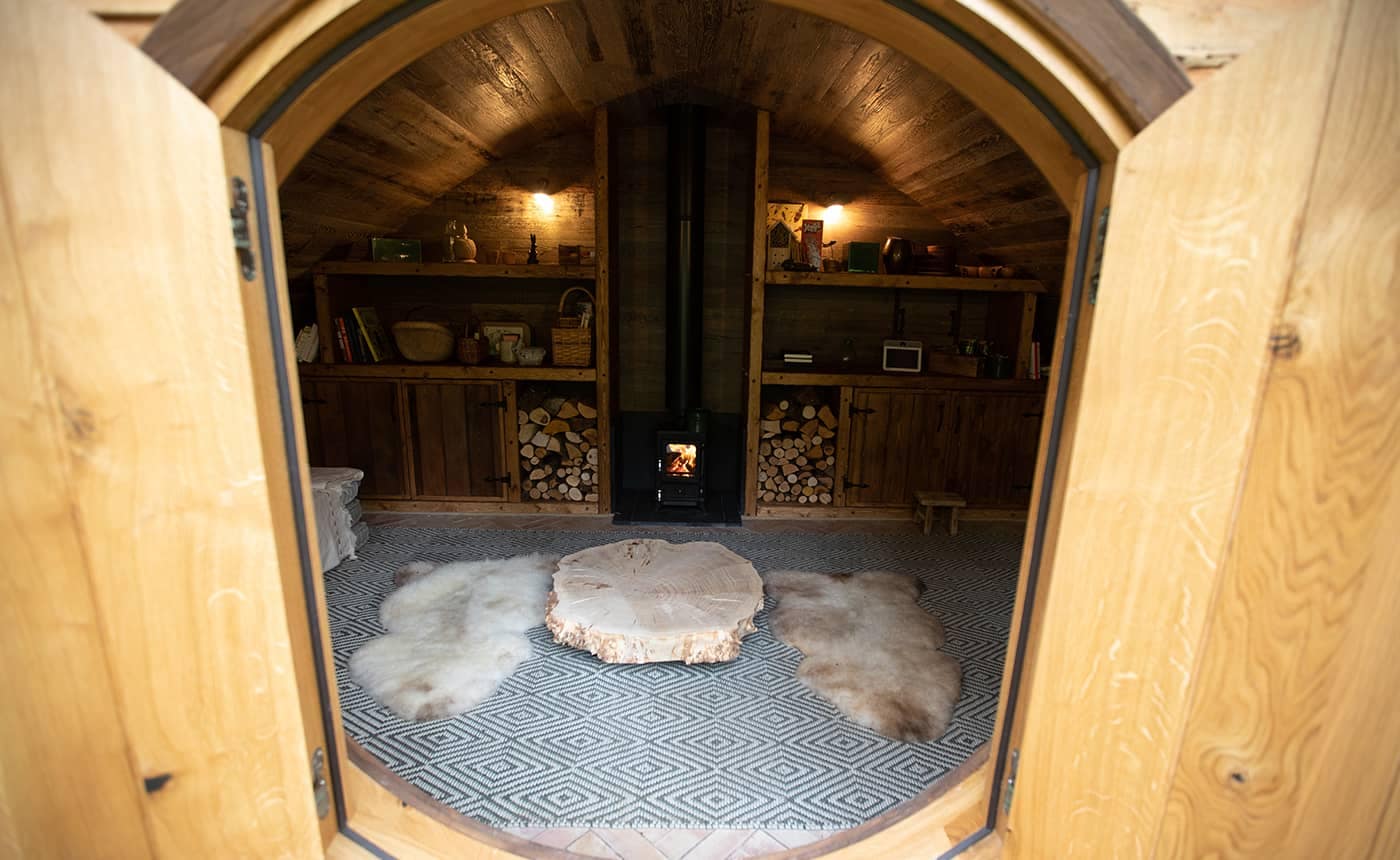 Hobbit small wood burning stove installed in a cabin designed by Blue Forest 4